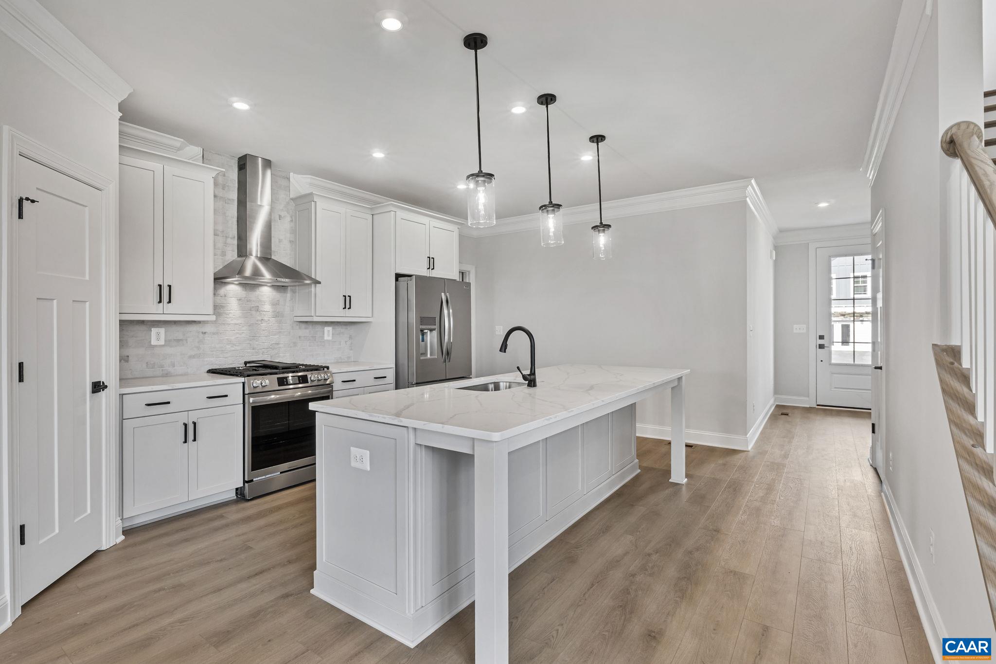 200 Marcella Street Charlottesville, VA 22911 - Photo 10 of 57 a large kitchen with stainless steel appliances granite countertop a stove a sink a refrigerator and white cabinets with wooden floor