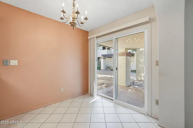 a kitchen that has a sink a stove and a microwave oven