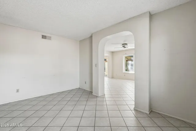 a view of a parking space in front of a house