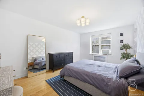 a bedroom with bed and window