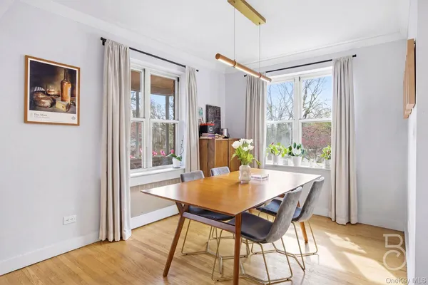 a view of a dining room with furniture window and outside view