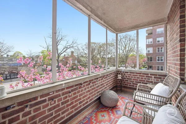 a very nice looking room with wooden floor and a potted plant