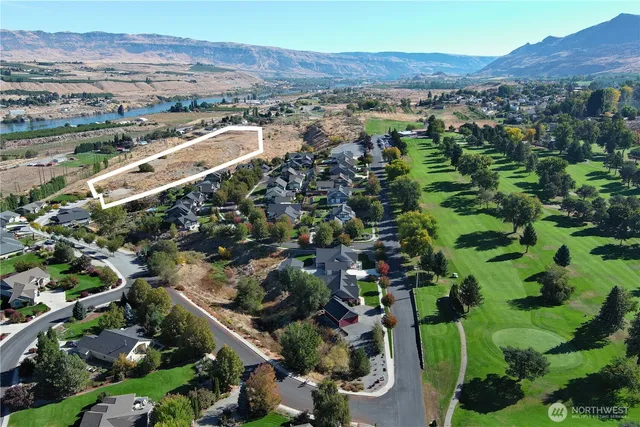 an aerial view of residential houses and outdoor space
