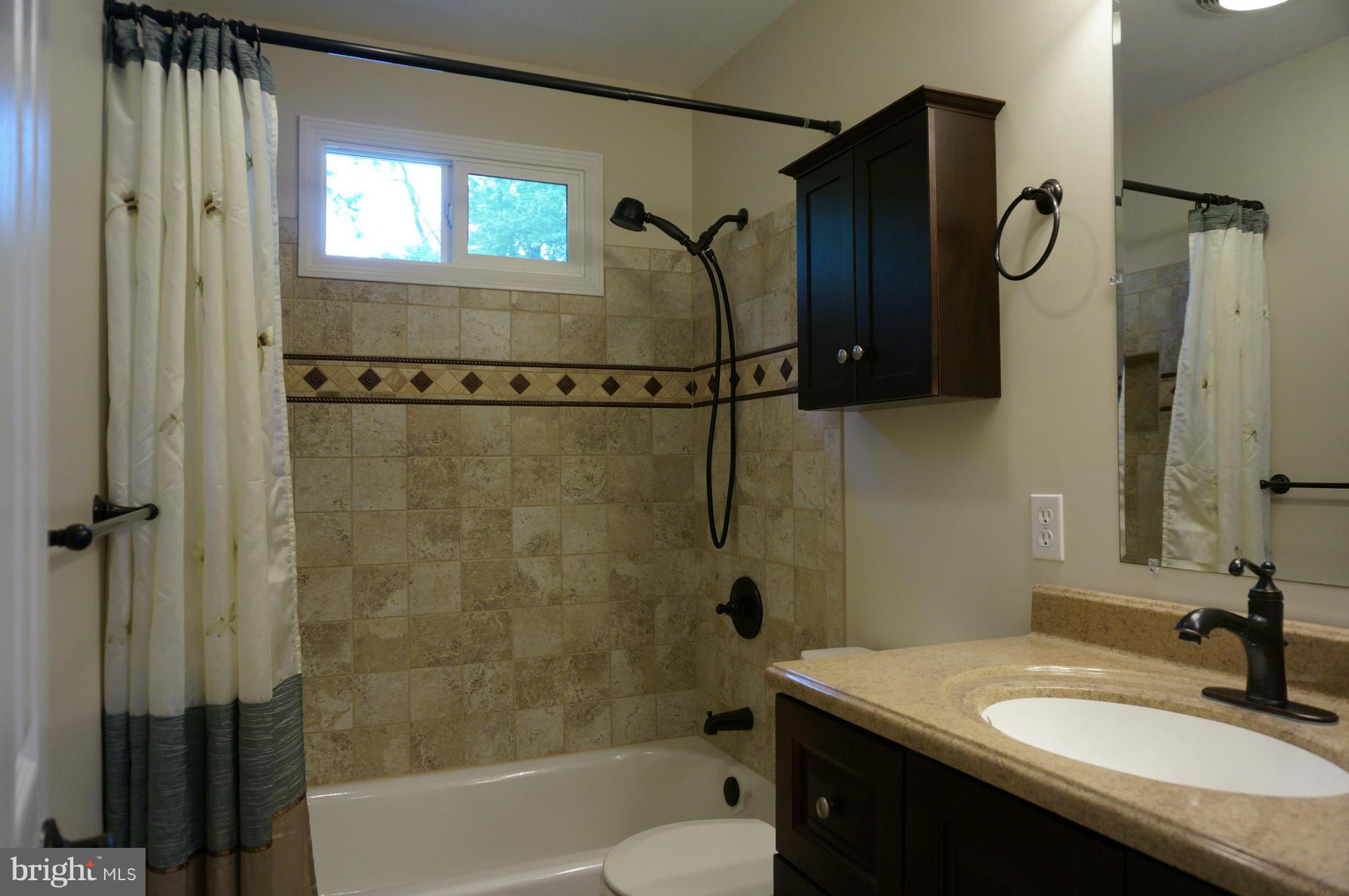 12704 Scaggsville Road Highland, MD 20777 - Photo 16 of 30 Remodeled Hall Bath - Ceramic Tub/Shower Walls