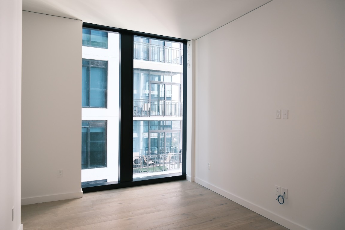 610 Davis Street, Unit 2708 Austin, TX 78701 - Photo 13 of 40 a view of an empty room with glass door