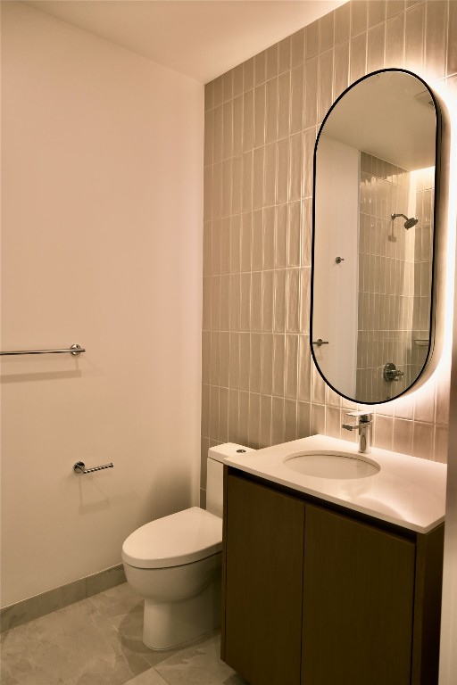 610 Davis Street, Unit 2708 Austin, TX 78701 - Photo 16 of 40 a bathroom with a sink mirror vanity and toilet