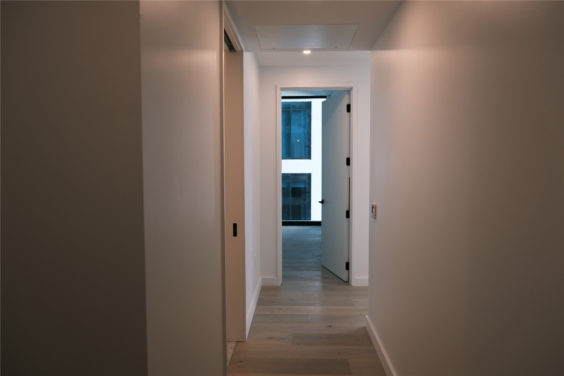 610 Davis Street, Unit 2708 Austin, TX 78701 - Photo 18 of 40 a view of a hallway with a room