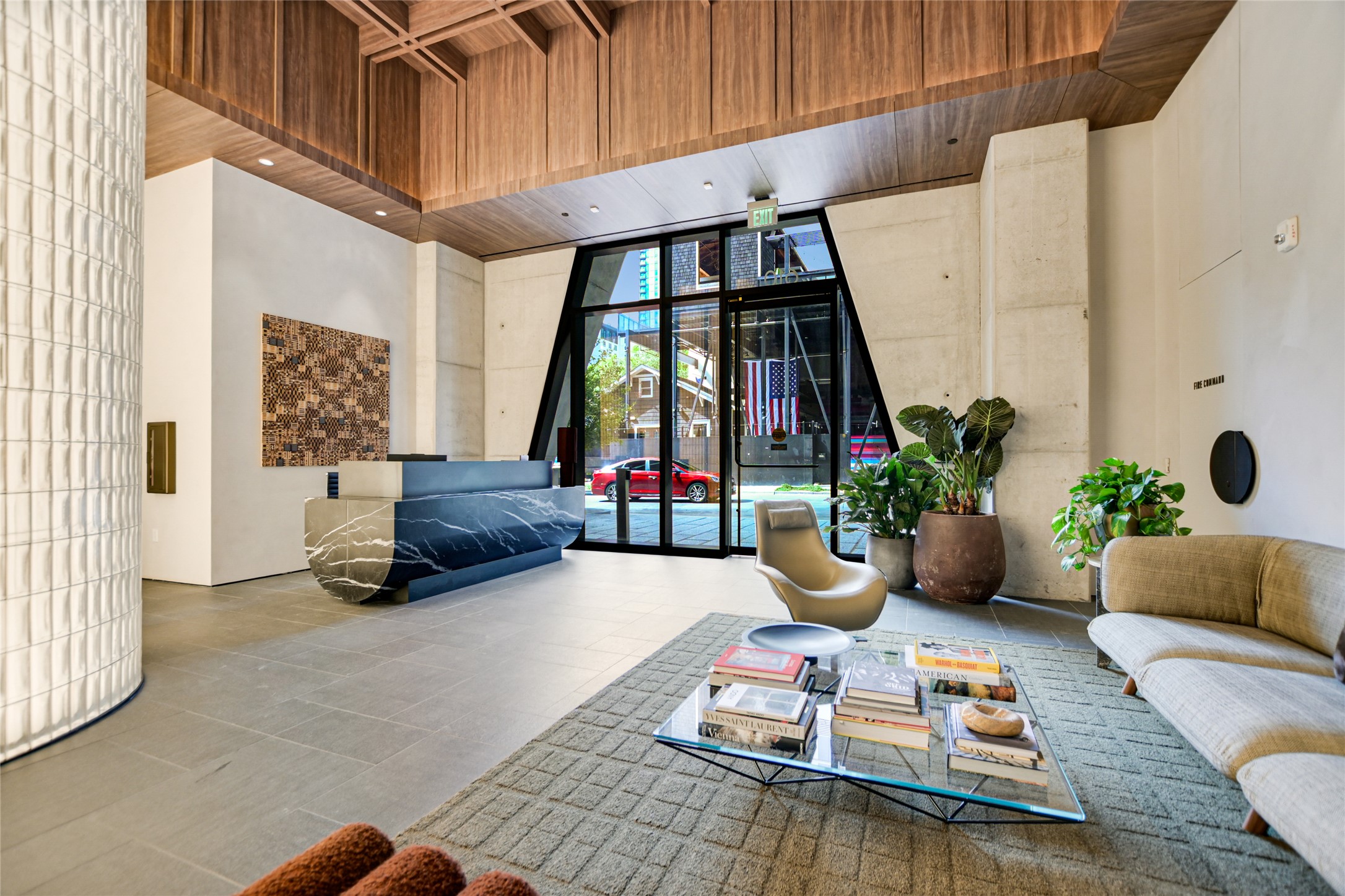 610 Davis Street, Unit 2708 Austin, TX 78701 - Photo 26 of 35 Building lobby featuring wooden ceiling, a wall of windows, and a towering ceiling