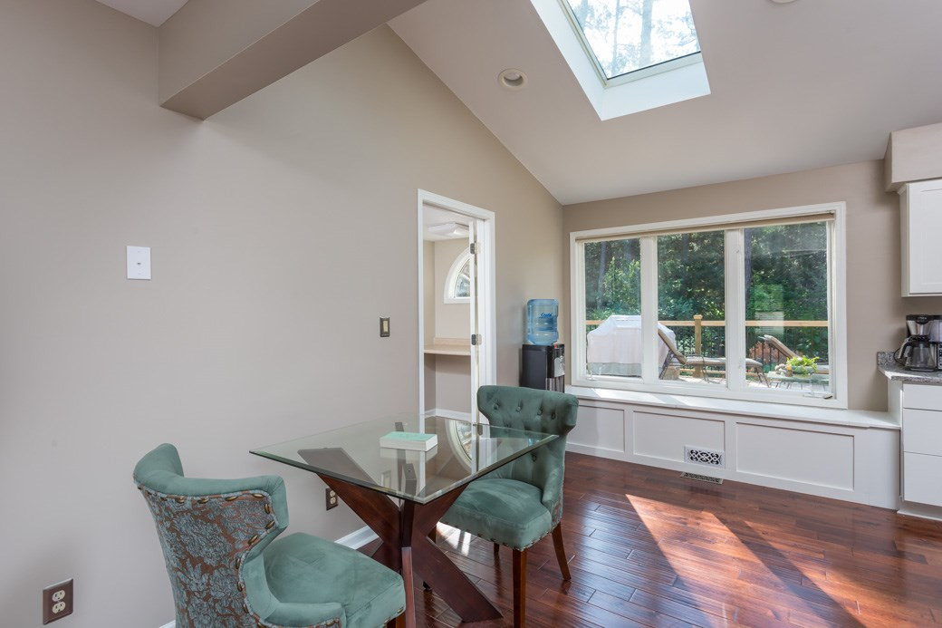 4213 Tolchester Place Raleigh, NC 27613 - Photo 6 of 25 Breakfast room with skylight and views of the amazing private yard! Breakfast nook