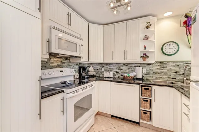 a kitchen with cabinets appliances and a counter top