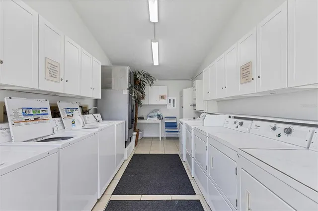 a view of a chairs and table under an umbrella in patio