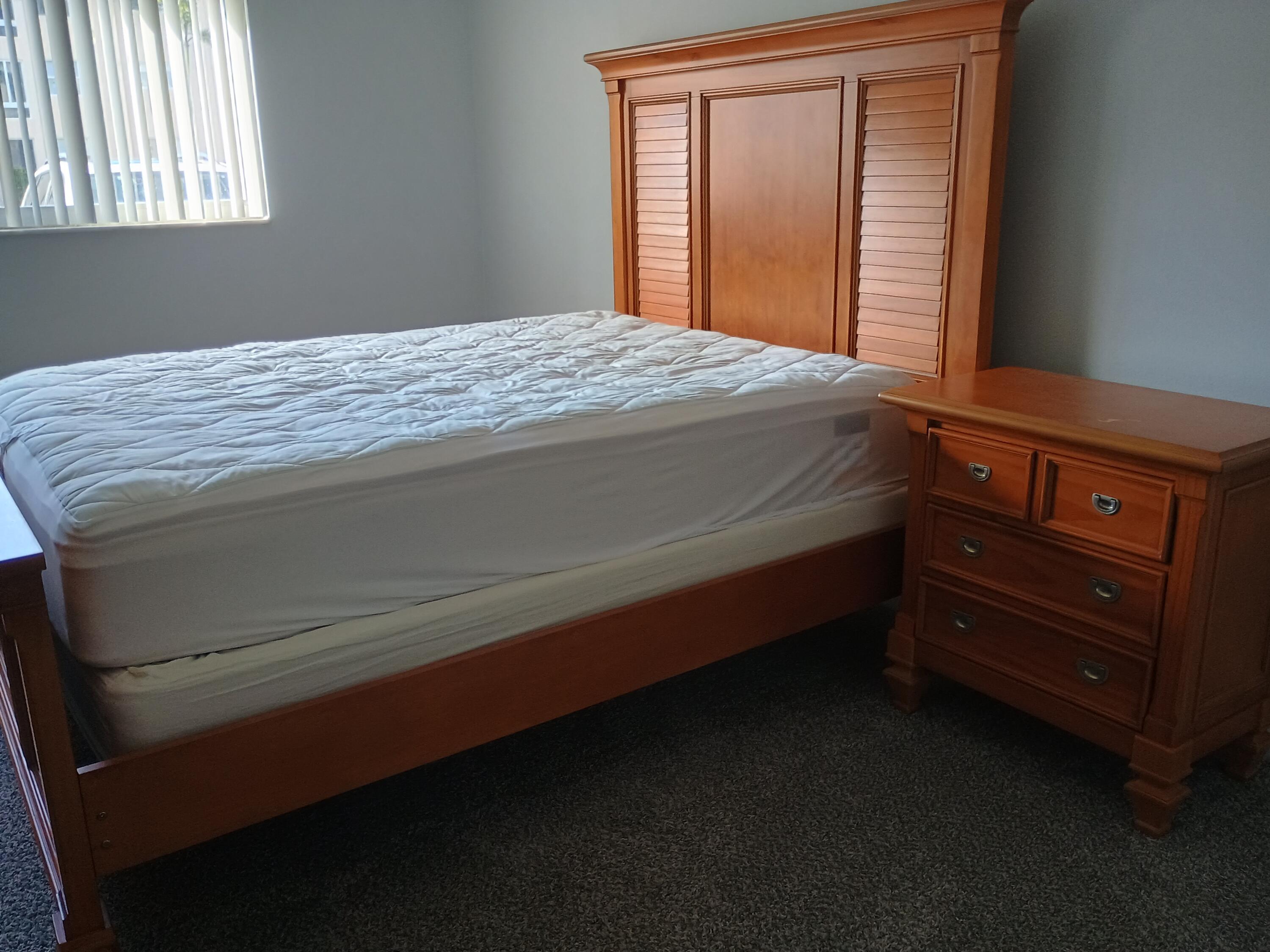 3 Colonial Club Drive, Unit 100 Boynton Beach, FL 33435 - Photo 12 of 26 a bedroom with a bed and window