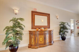3 Colonial Club Drive, Unit 100 Boynton Beach, FL 33435 - Photo 20 of 26 a bathroom with a potted plant and a sink