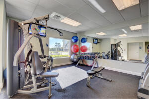 3 Colonial Club Drive, Unit 100 Boynton Beach, FL 33435 - Photo 23 of 26 a view of a room with gym equipment