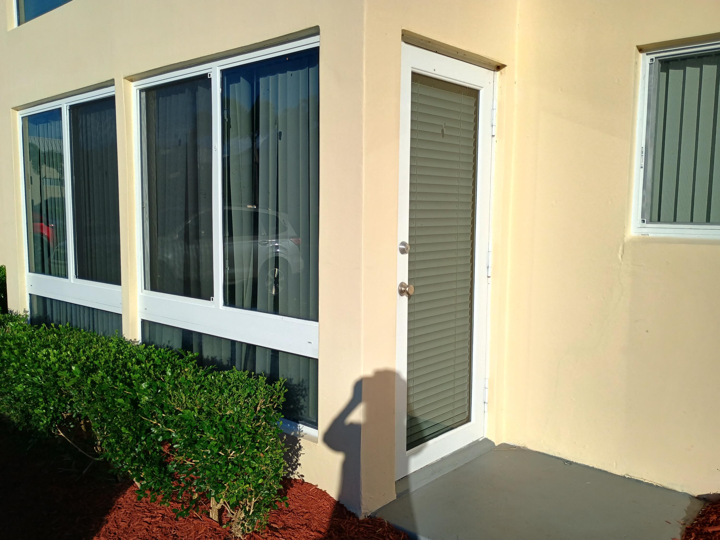 3 Colonial Club Drive, Unit 100 Boynton Beach, FL 33435 - Photo 3 of 26 a view of a porch