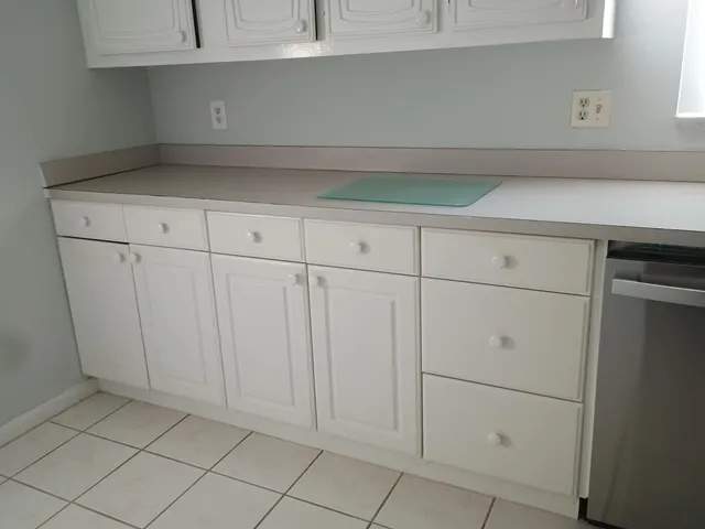 a dining room with furniture and a window