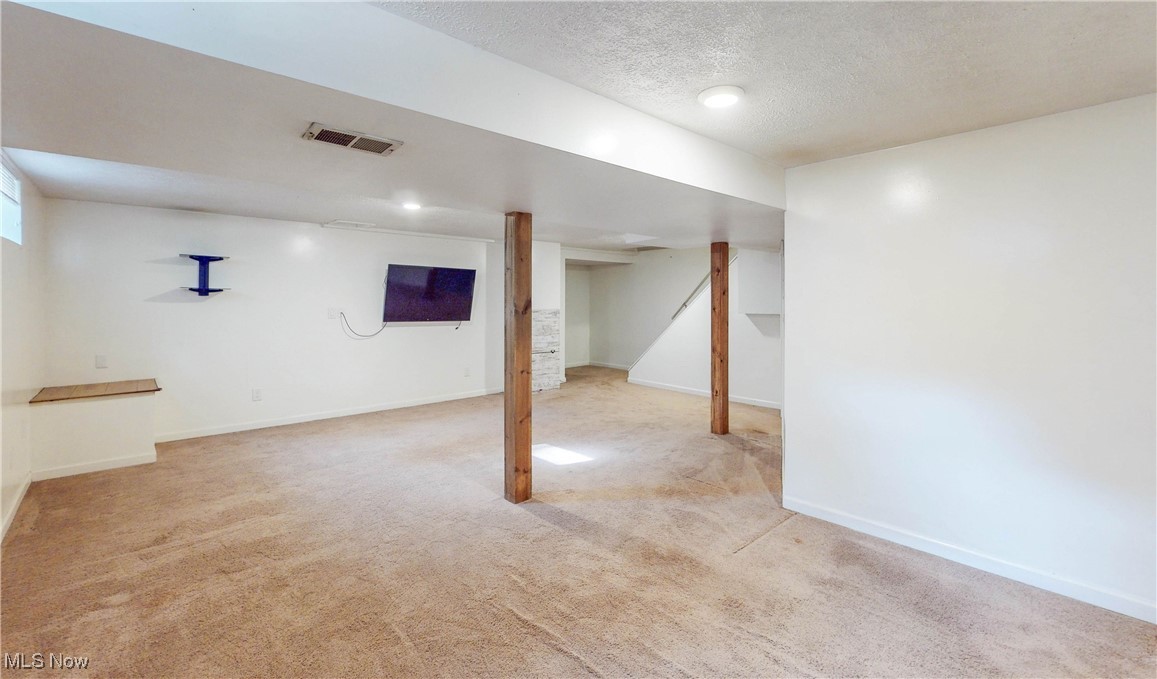 3491 Kent Road Stow, OH 44224 - Photo 28 of 40 Basement view with mounted TV
