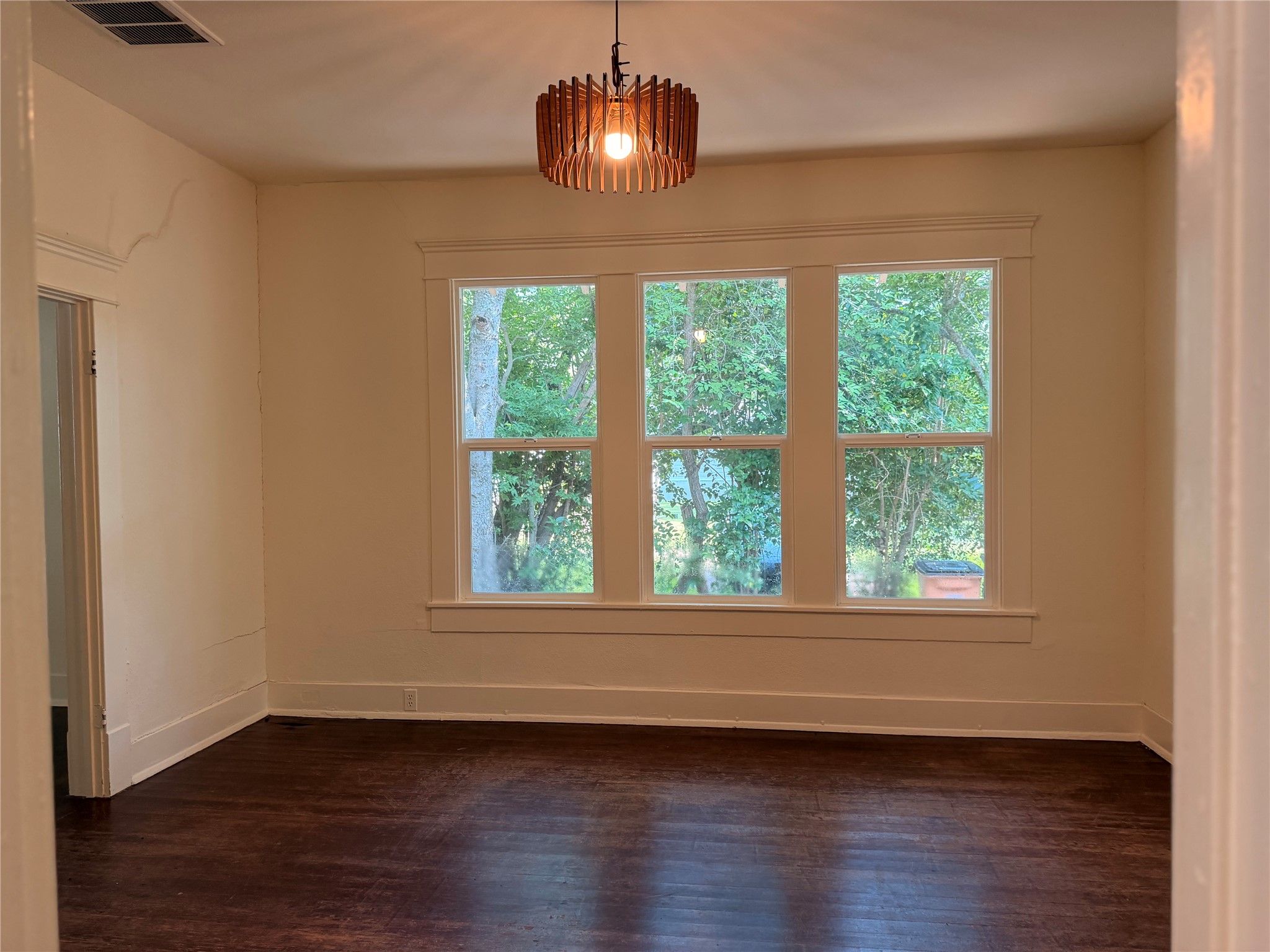 1136 Eleanor Street Austin, TX 78721 - Photo 16 of 30 Hardwood floors and generous window light define this inviting space.