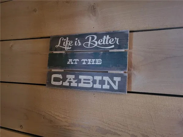 a sign on a refrigerator in a room