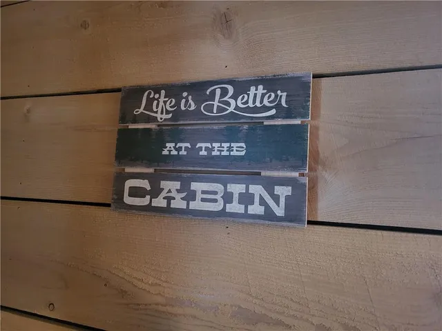 a sign on a refrigerator in a room