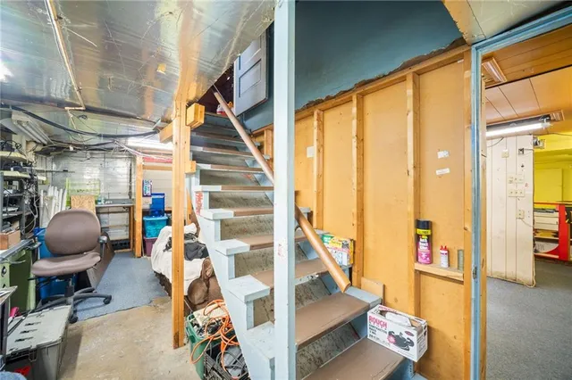 a view of entryway with wooden floor and living room
