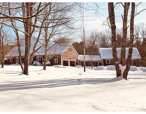 127 W Road Petersham, MA 01366 - Photo 1 of 12 a view of a house with snow on the road