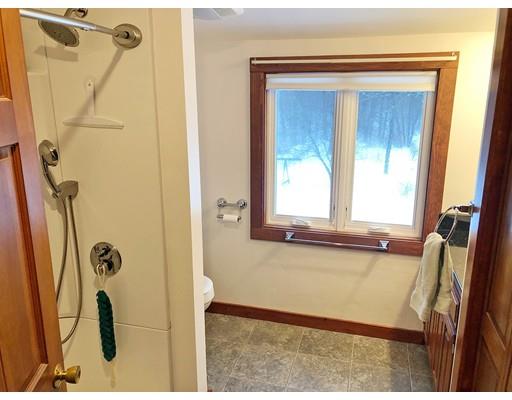 127 W Road Petersham, MA 01366 - Photo 11 of 12 a bathroom with a tub sink a mirror and a shower