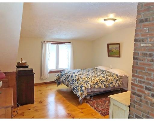 127 W Road Petersham, MA 01366 - Photo 4 of 12 a bedroom with a bed and wooden floor