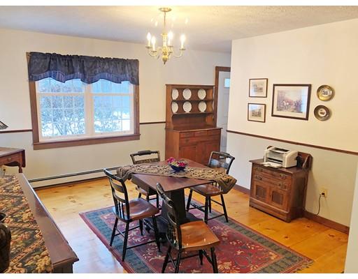 127 W Road Petersham, MA 01366 - Photo 6 of 12 a view of a dining room with furniture and chandelier