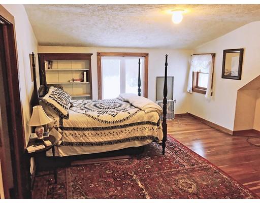 127 W Road Petersham, MA 01366 - Photo 7 of 12 a bed sitting in a spacious bedroom next to a window