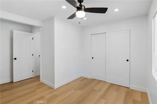 a view of an empty room and a window