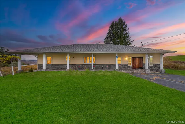 front view of a house with a yard