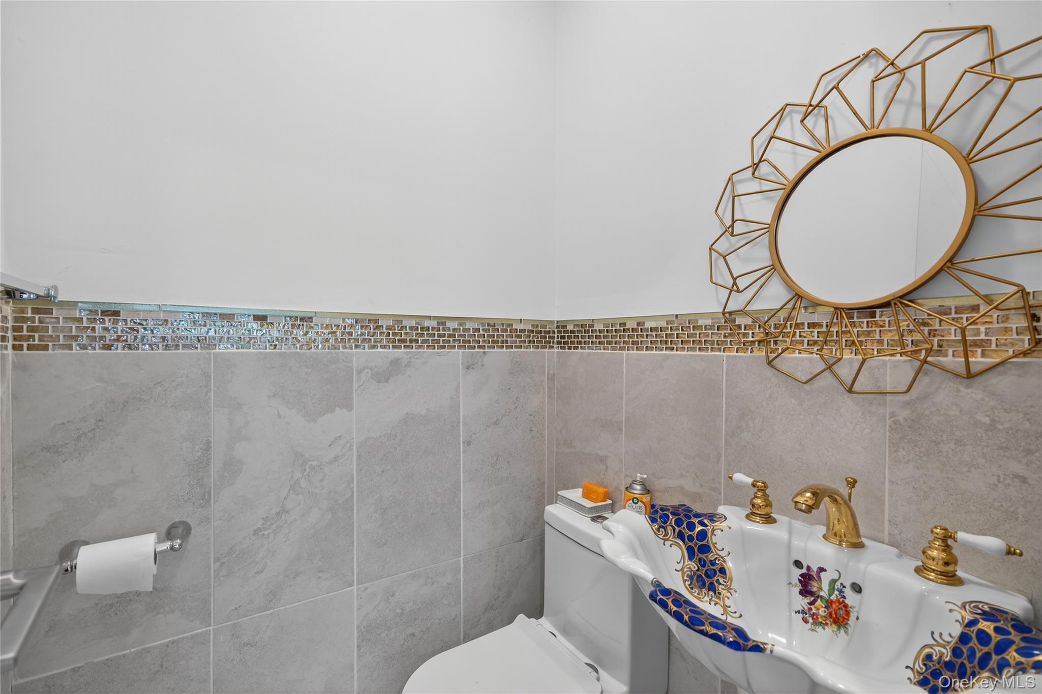 6049 State Rte 55 Liberty, NY 12754 - Photo 11 of 50 a bathroom with a sink mirror vanity and toilet