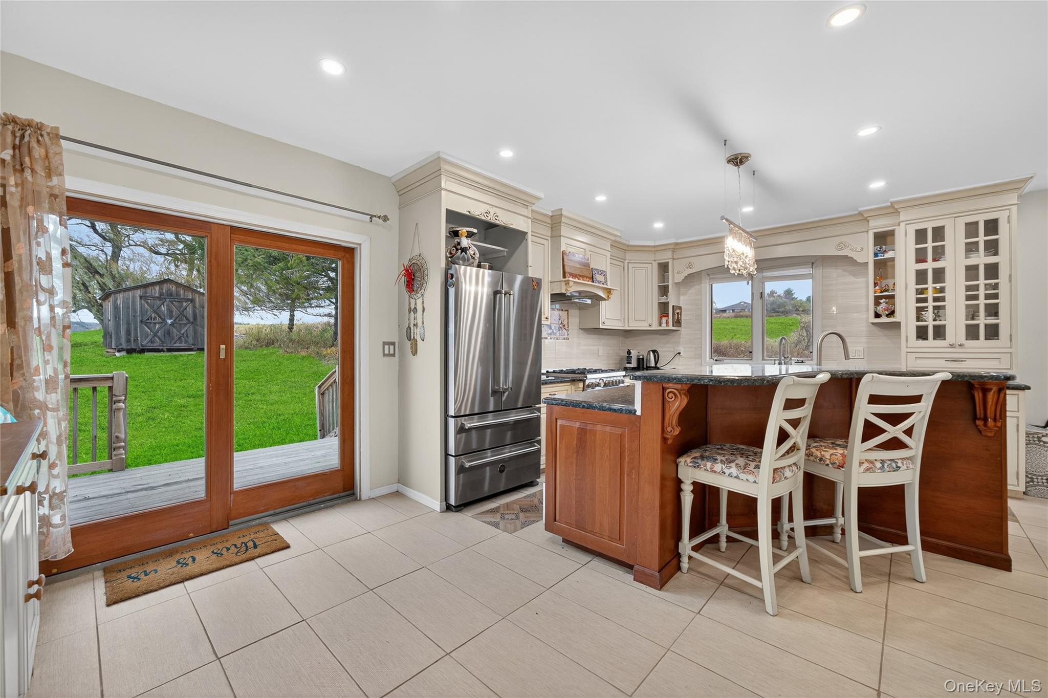 6049 State Rte 55 Liberty, NY 12754 - Photo 12 of 50 a kitchen with stainless steel appliances granite countertop a refrigerator and a sink