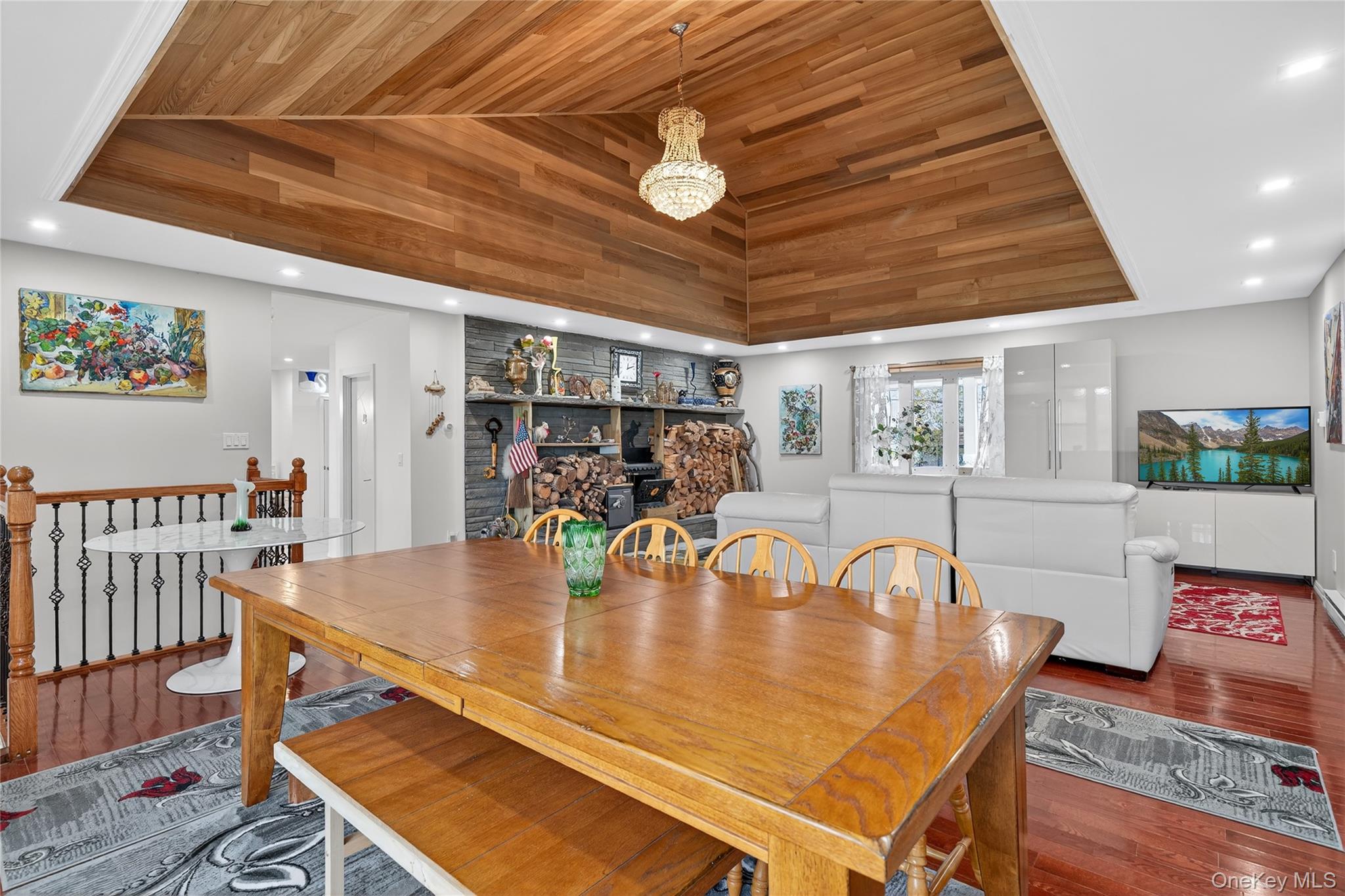 6049 State Rte 55 Liberty, NY 12754 - Photo 15 of 50 a room with table chairs and wooden floor