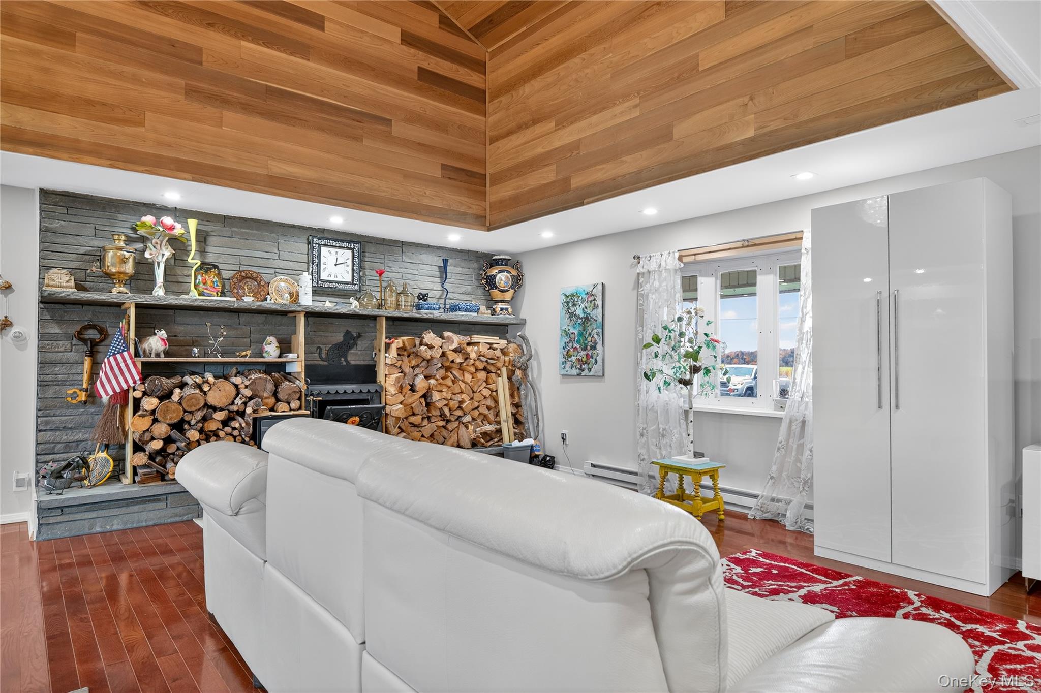6049 State Rte 55 Liberty, NY 12754 - Photo 17 of 50 a bed room with a bed and a book shelf