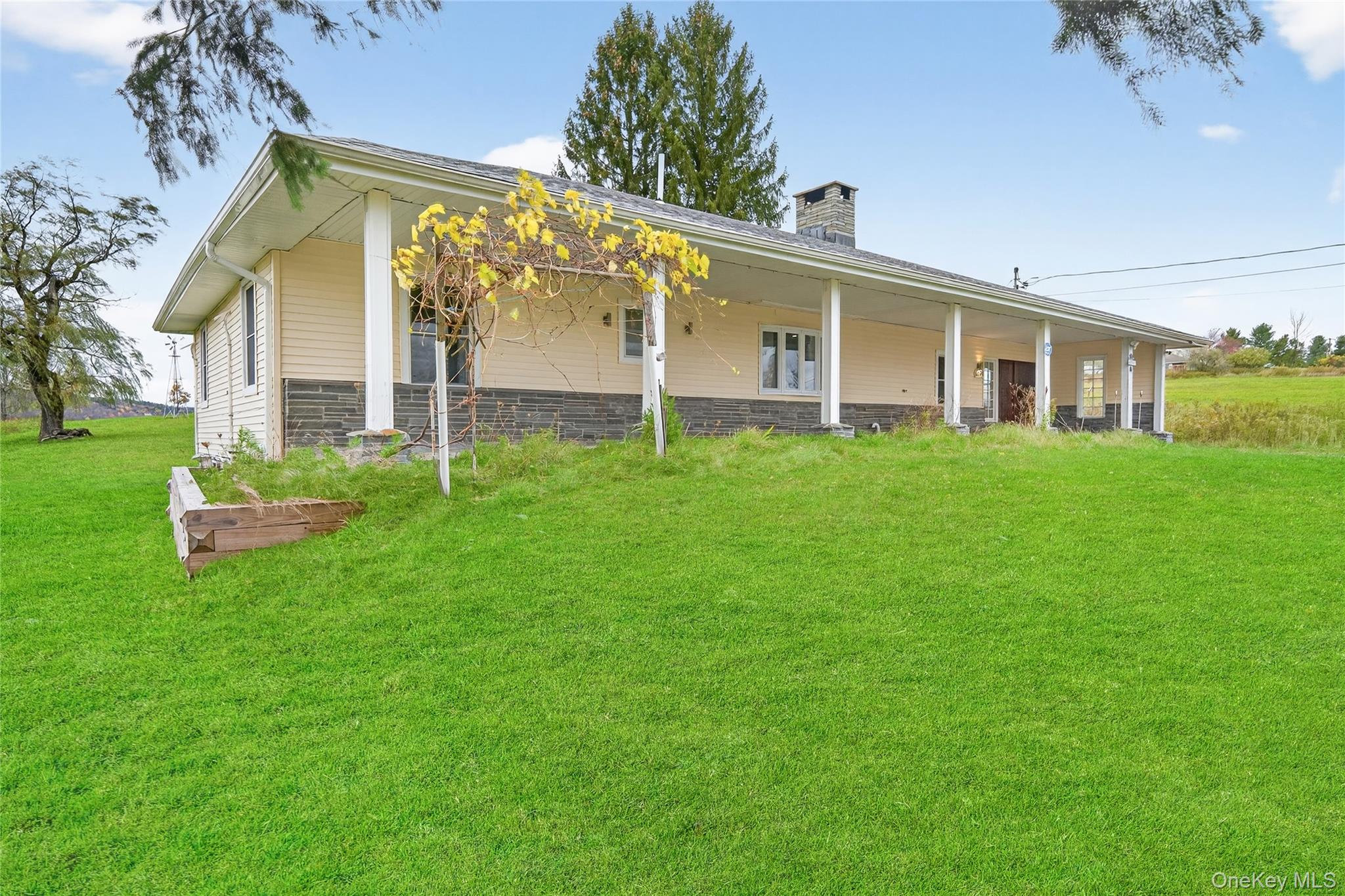 6049 State Rte 55 Liberty, NY 12754 - Photo 2 of 50 a front view of a house with a yard