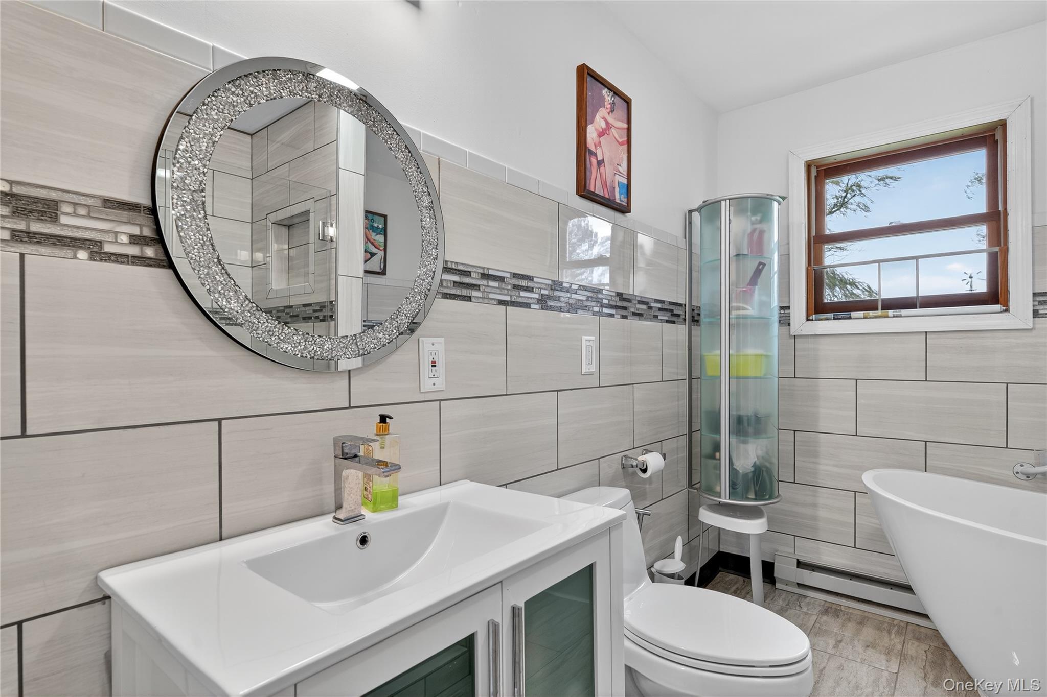 6049 State Rte 55 Liberty, NY 12754 - Photo 21 of 50 a bathroom with a sink a toilet and shower