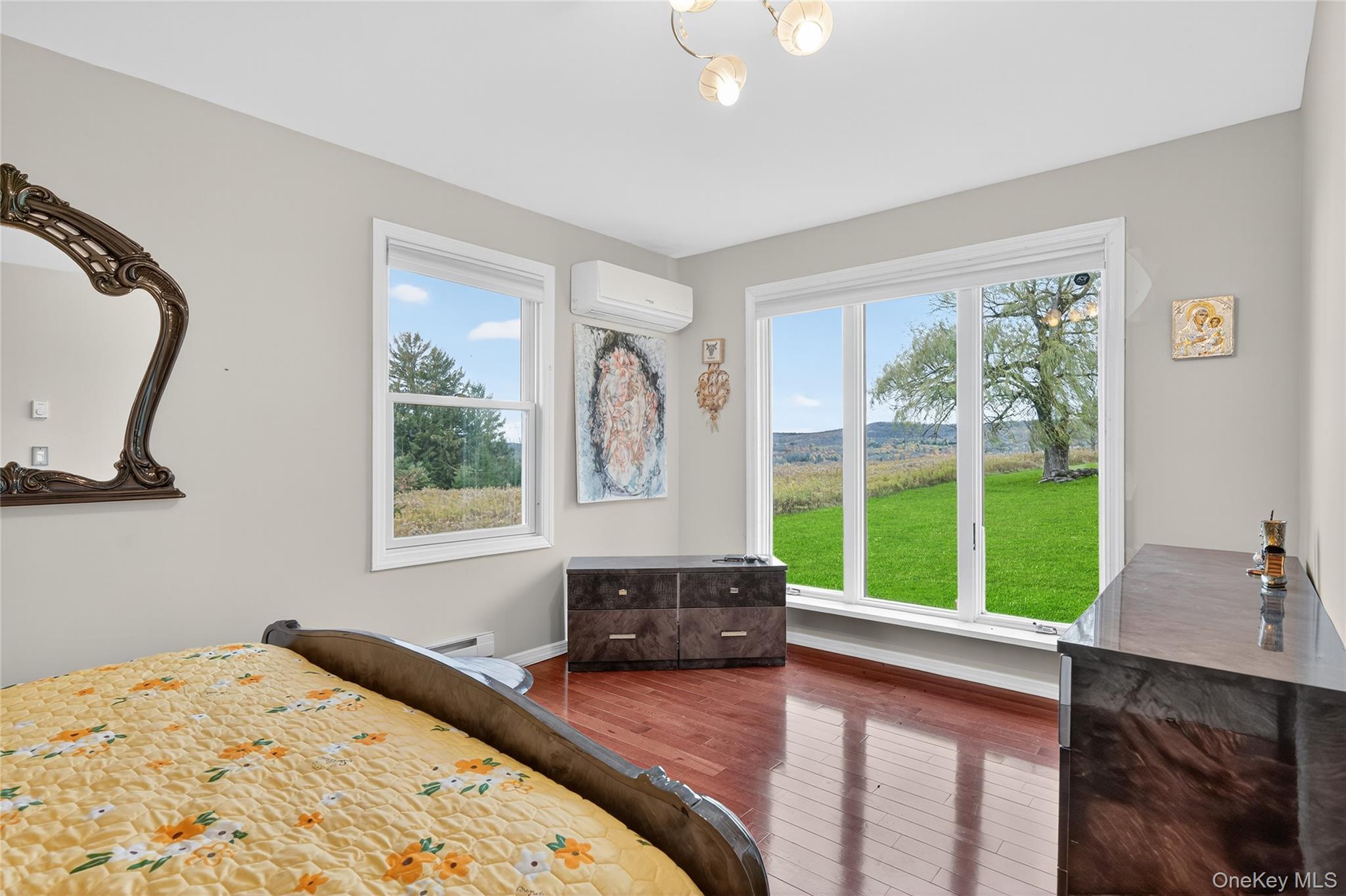 6049 State Rte 55 Liberty, NY 12754 - Photo 22 of 50 a bedroom with a bed and a large window