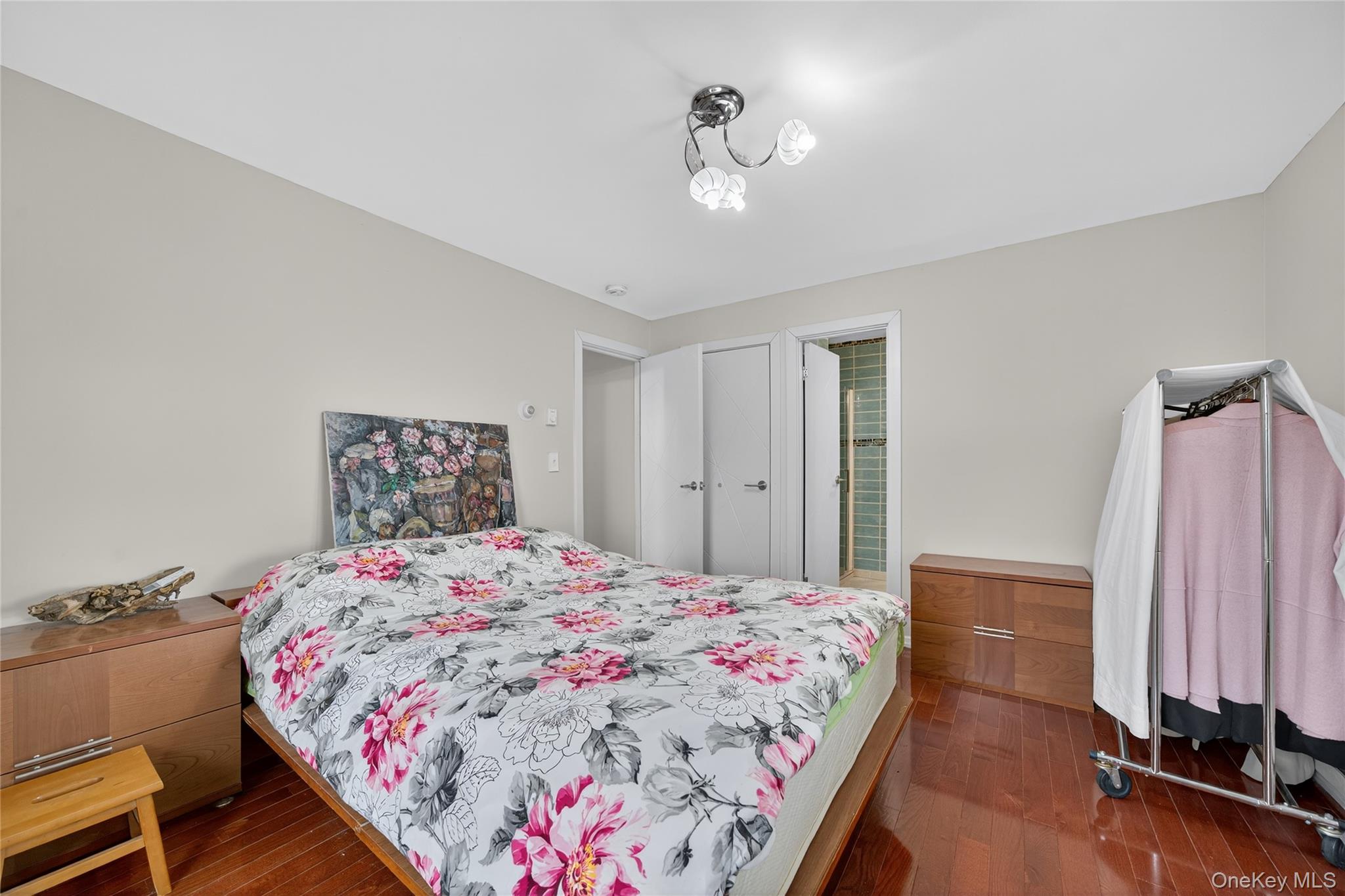 6049 State Rte 55 Liberty, NY 12754 - Photo 25 of 50 a bedroom with a bed and a chandelier