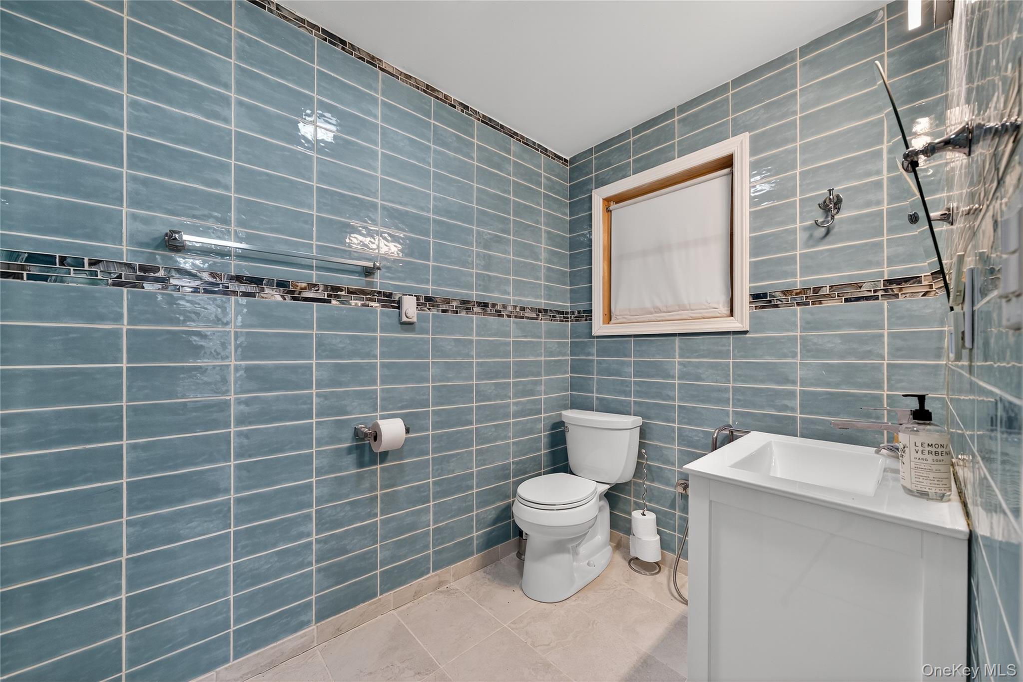 6049 State Rte 55 Liberty, NY 12754 - Photo 26 of 50 a bathroom with a toilet and a sink