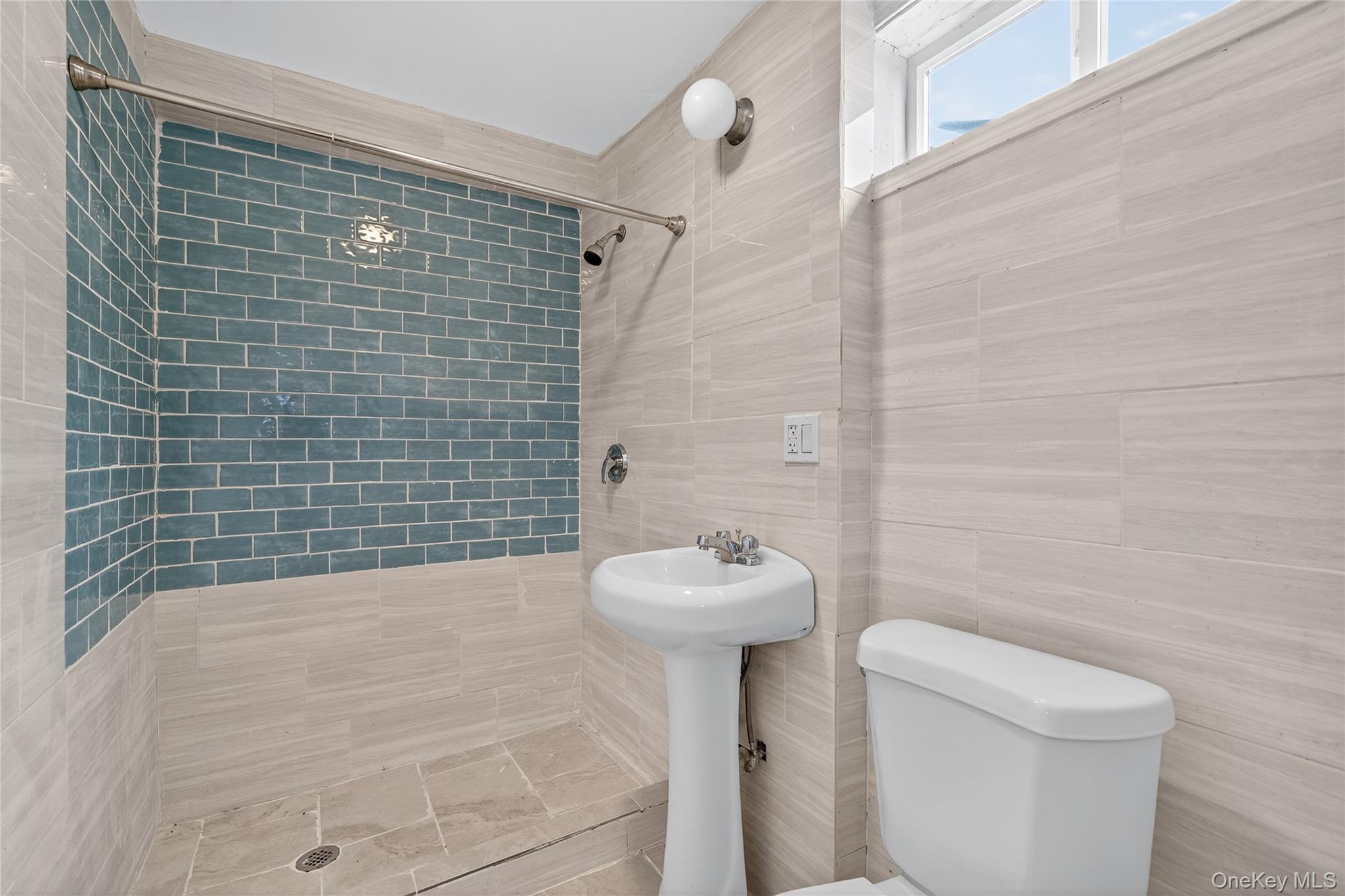 6049 State Rte 55 Liberty, NY 12754 - Photo 30 of 50 a bathroom with a sink toilet and shower