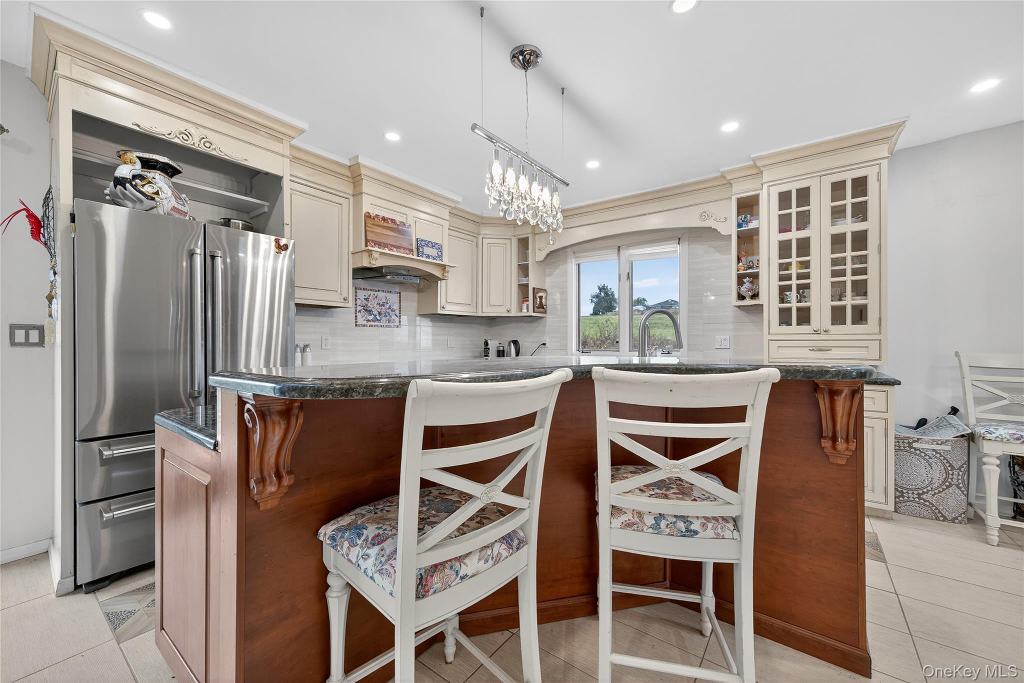 6049 State Rte 55 Liberty, NY 12754 - Photo 33 of 50 a kitchen with stainless steel appliances kitchen island granite countertop a refrigerator and microwave