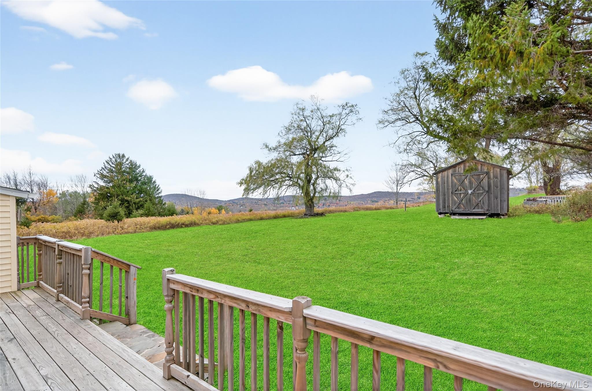 6049 State Rte 55 Liberty, NY 12754 - Photo 36 of 50 a view of a deck with a garden