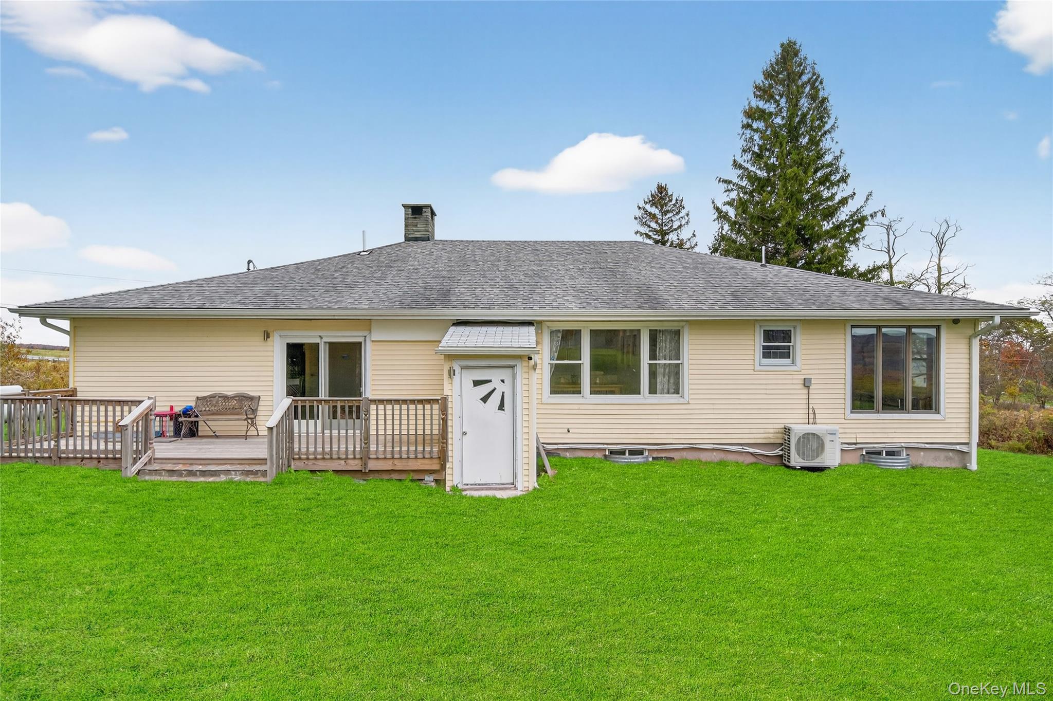 6049 State Rte 55 Liberty, NY 12754 - Photo 37 of 50 a front view of house with yard and outdoor seating