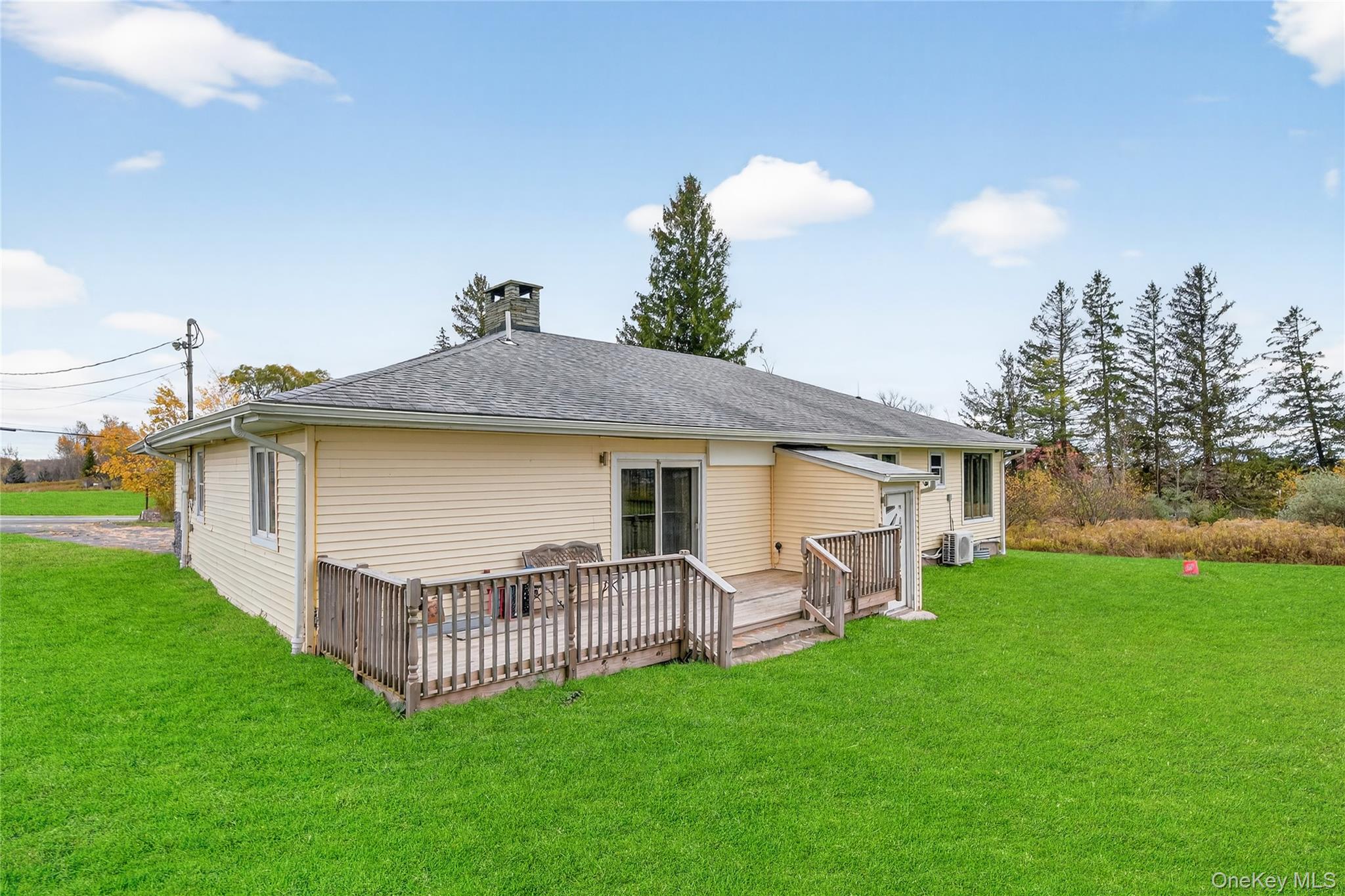 6049 State Rte 55 Liberty, NY 12754 - Photo 38 of 50 a view of a house with a yard and deck