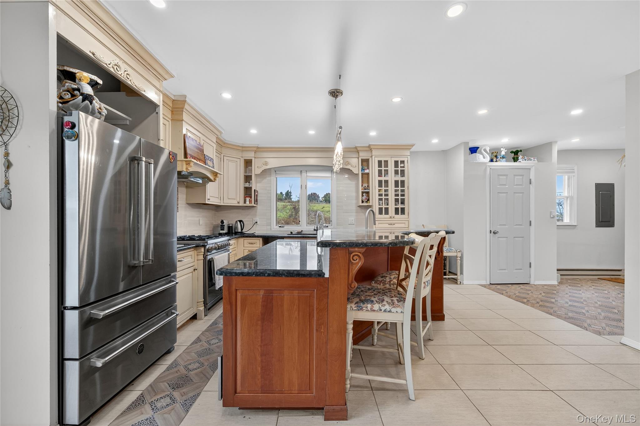 6049 State Rte 55 Liberty, NY 12754 - Photo 7 of 50 a kitchen with stainless steel appliances granite countertop a refrigerator and a stove top oven