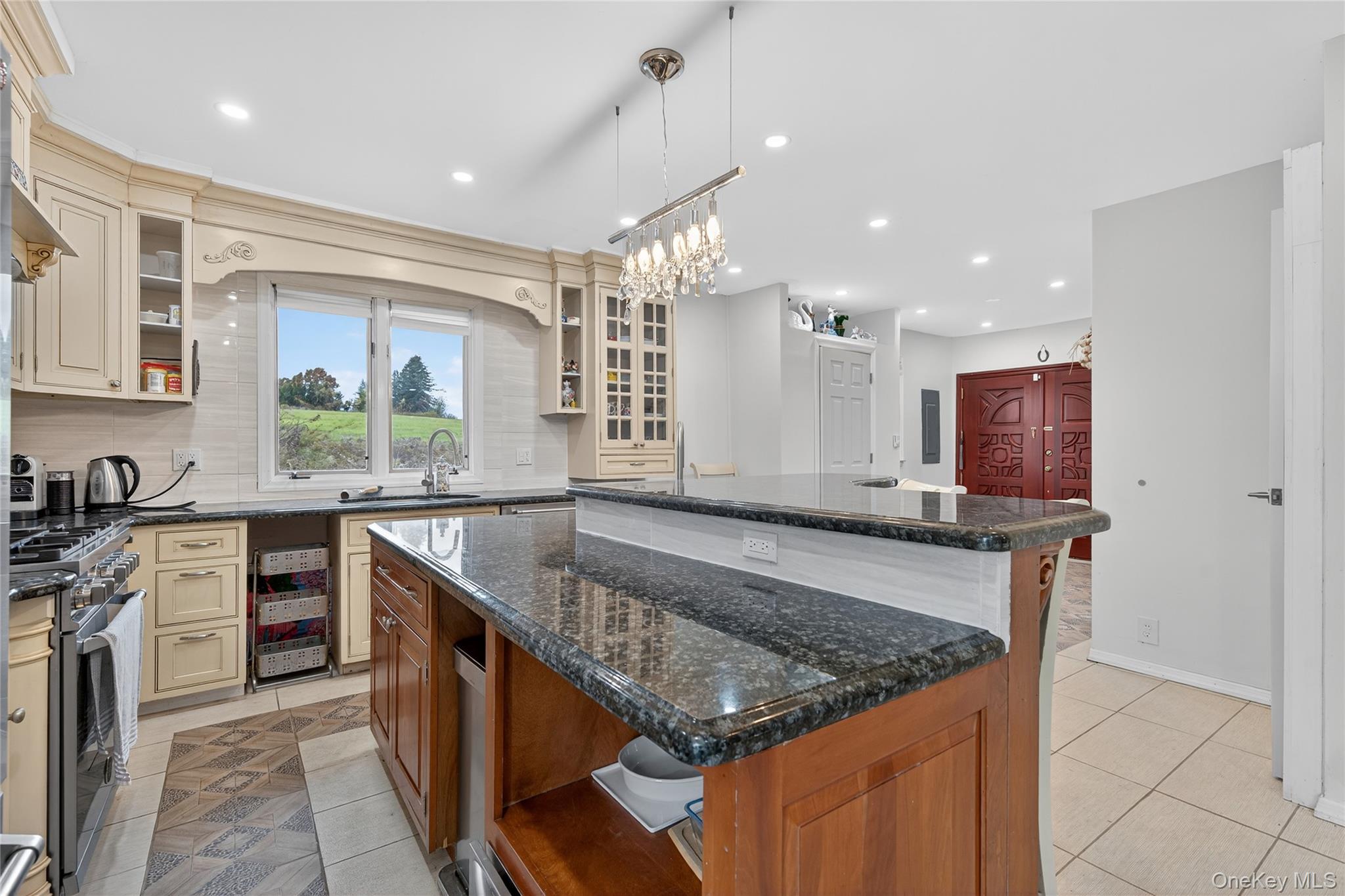 6049 State Rte 55 Liberty, NY 12754 - Photo 10 of 50 a kitchen with kitchen island granite countertop a stove and a sink