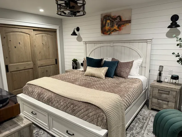 a bedroom with a bed and a cabinets