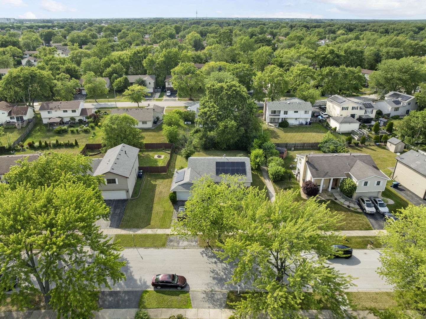 116 Cloverleaf Road Matteson, IL 60443 - Photo 7 of 8 an aerial view of a house with a yard basket ball court and outdoor seating